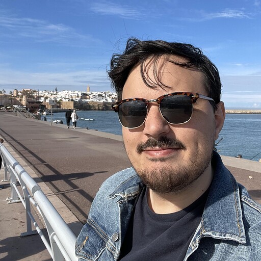 Photo of Josef in front of the ocean in Rabat, Morocco. Sunny day.